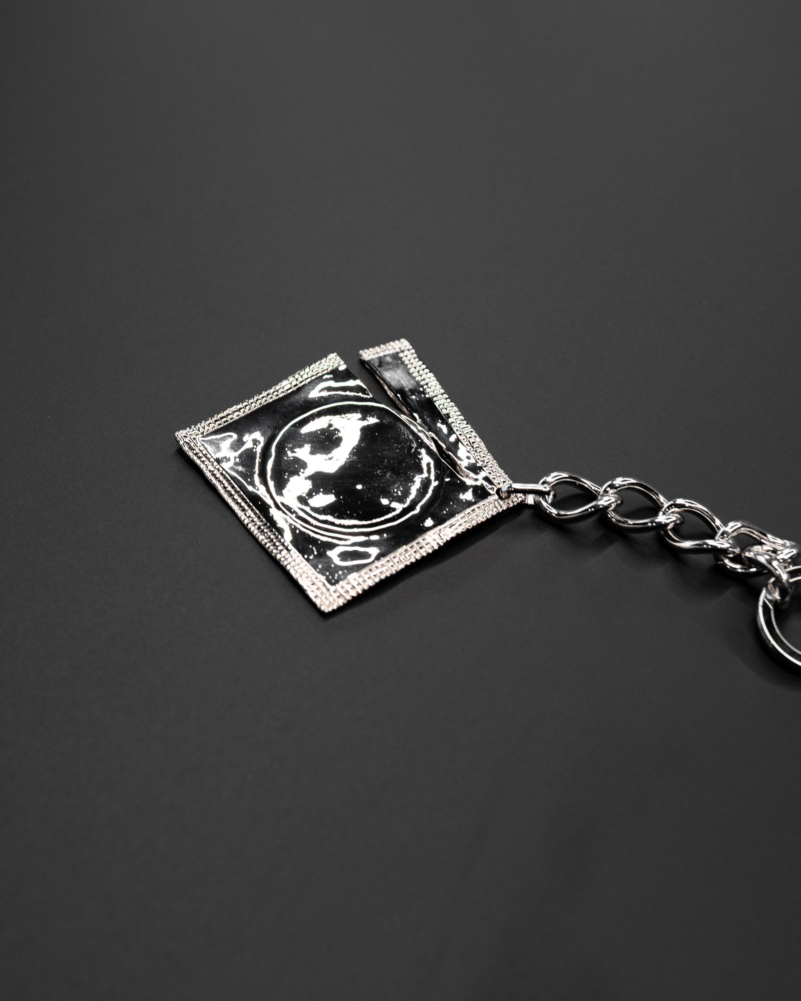 Ripped Raincoat Keyring / Silver