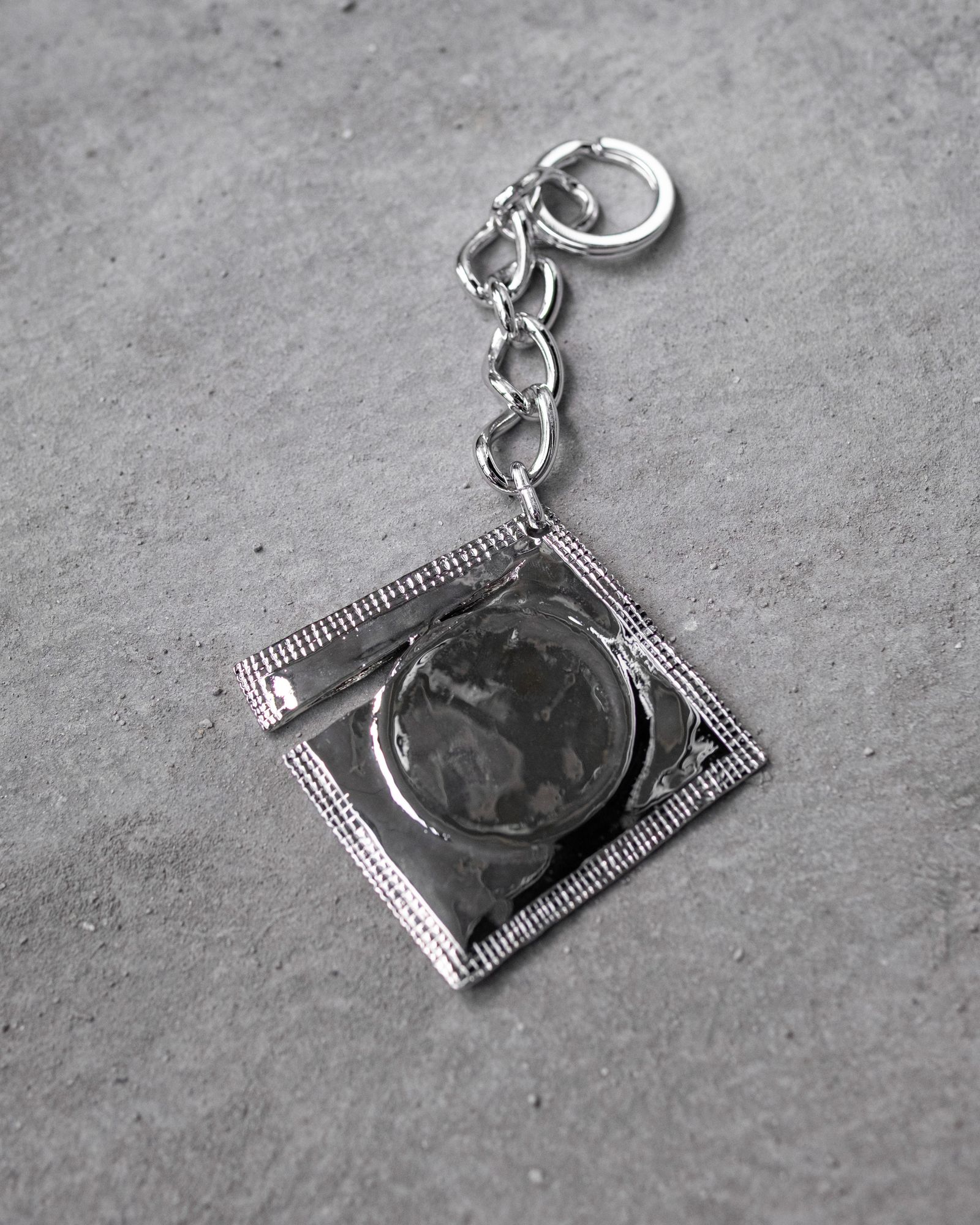 Ripped Raincoat Keyring / Silver