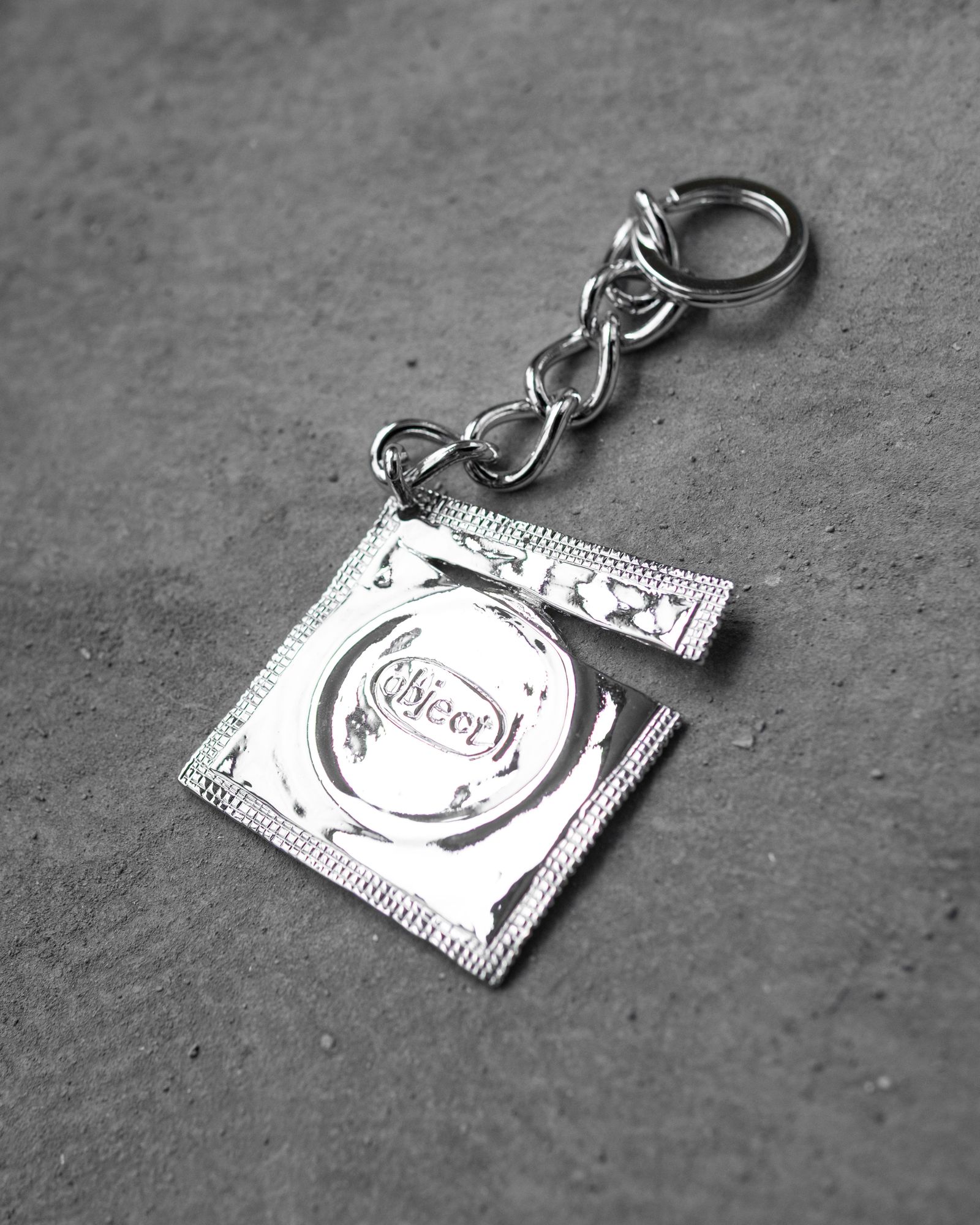 Ripped Raincoat Keyring / Silver