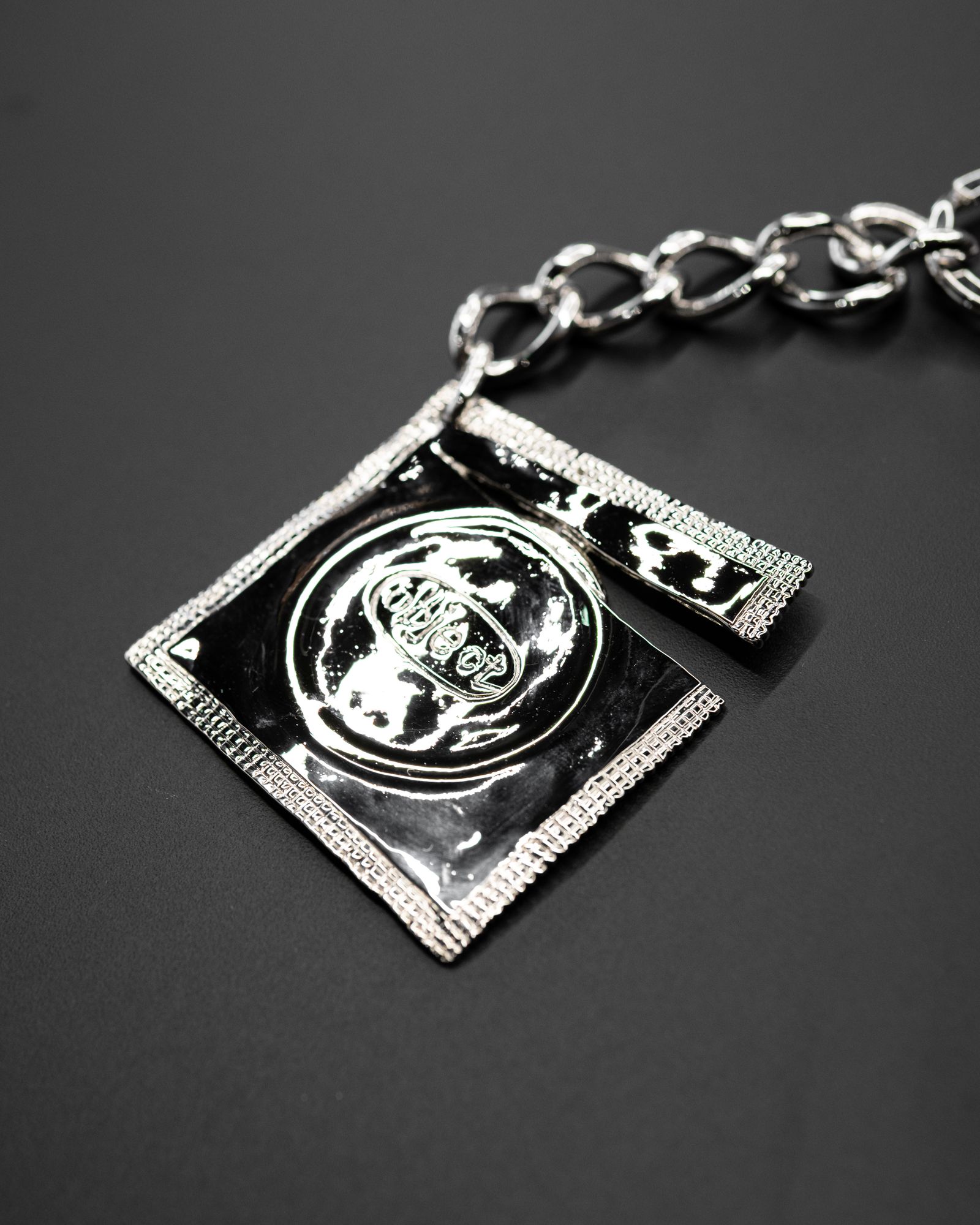 Ripped Raincoat Keyring / Silver