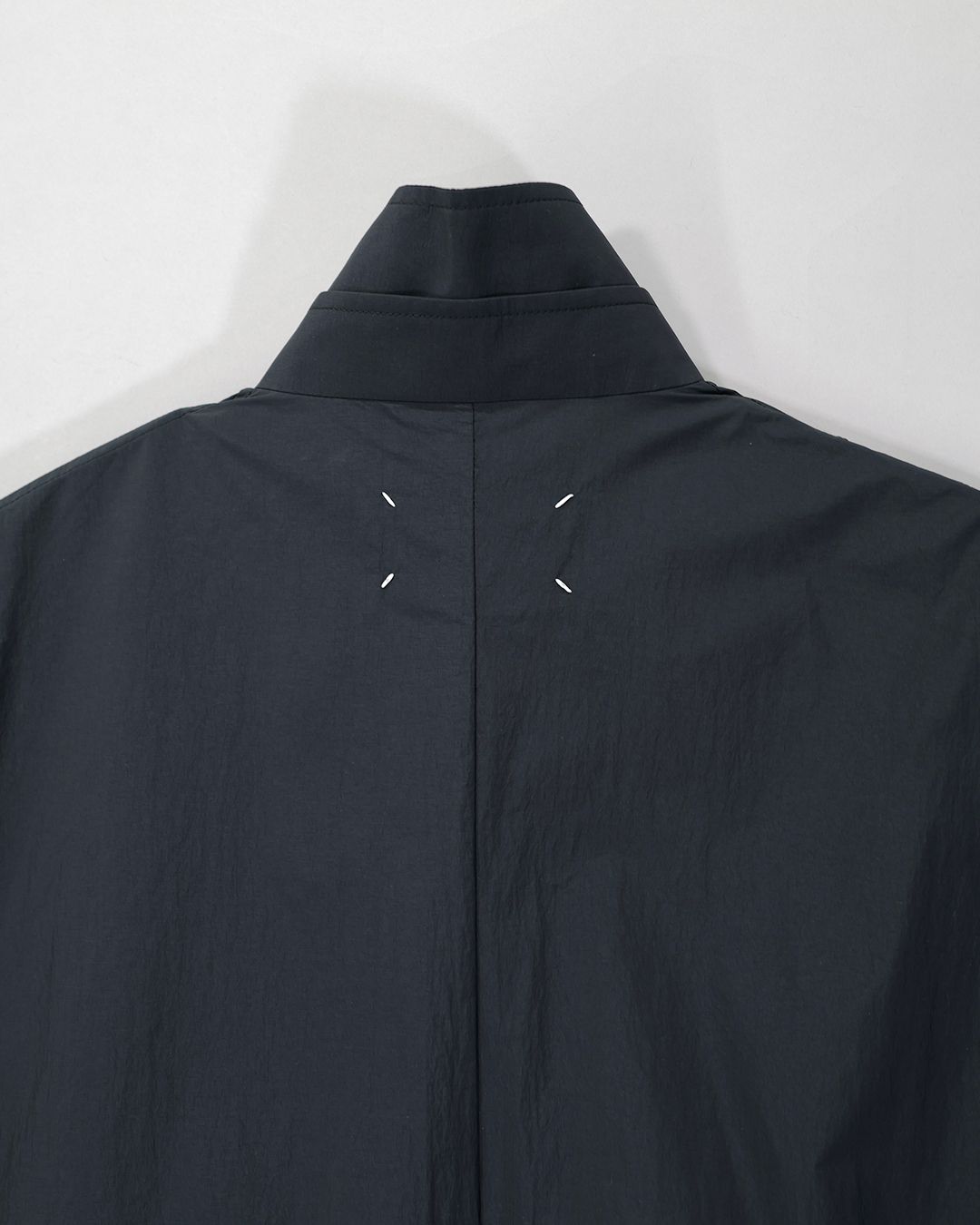 OVERSIZE RAIN COAT .