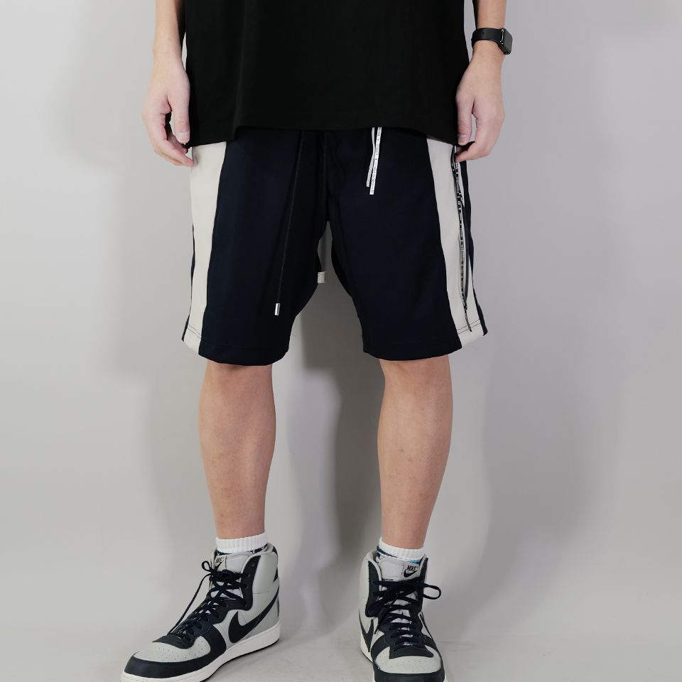 【MASTERMIND WORLD】 SIDE LINE TRACK SHORTS  NAVY x GREIGE