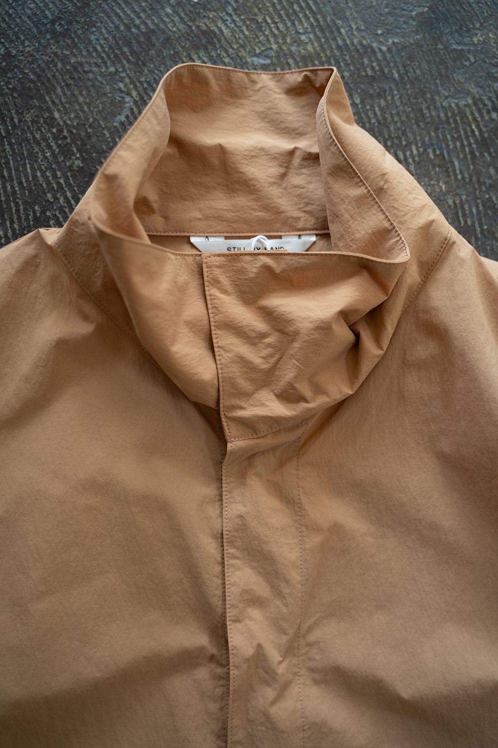 【24AW】撥水ナイロンパッカブルアノラック(PALE ORANGE)