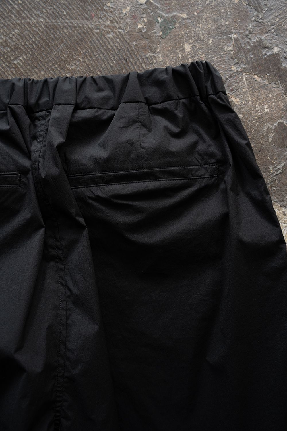 【26SS】ストレッチナイロンテーパードパンツ(BLACK)