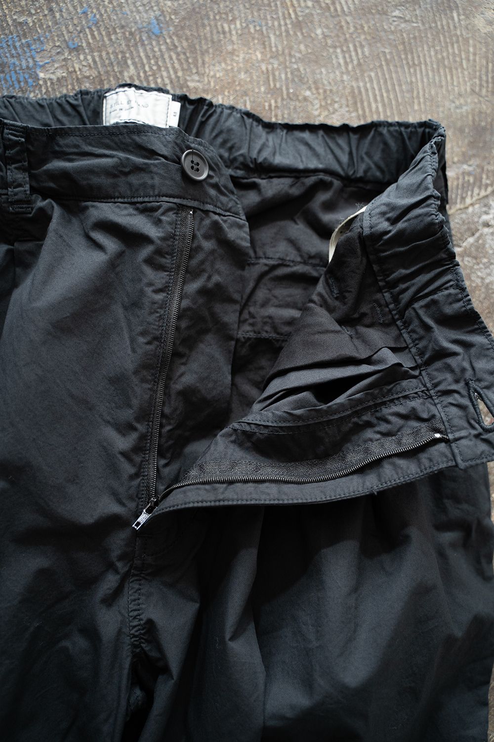 【25SS】ガーメントダイ2タックワイドテーパードパンツ(INK BLACK)