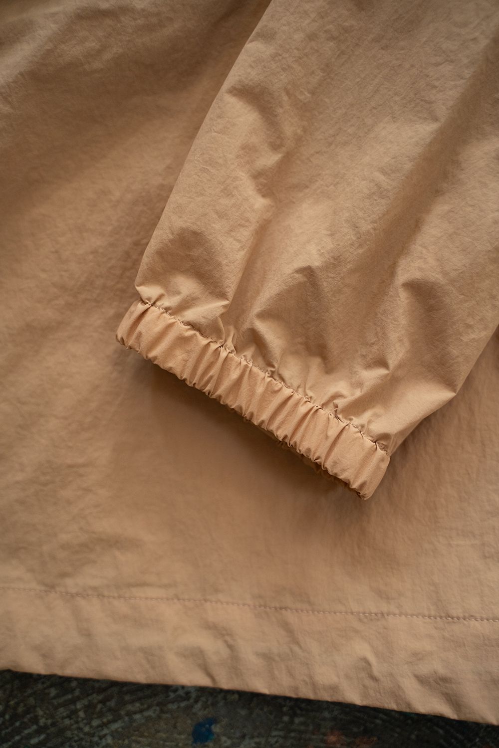 【24AW】撥水ナイロンパッカブルアノラック(PALE ORANGE)