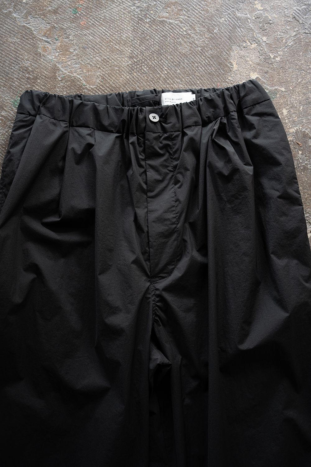 【26SS】ストレッチナイロンテーパードパンツ(BLACK)