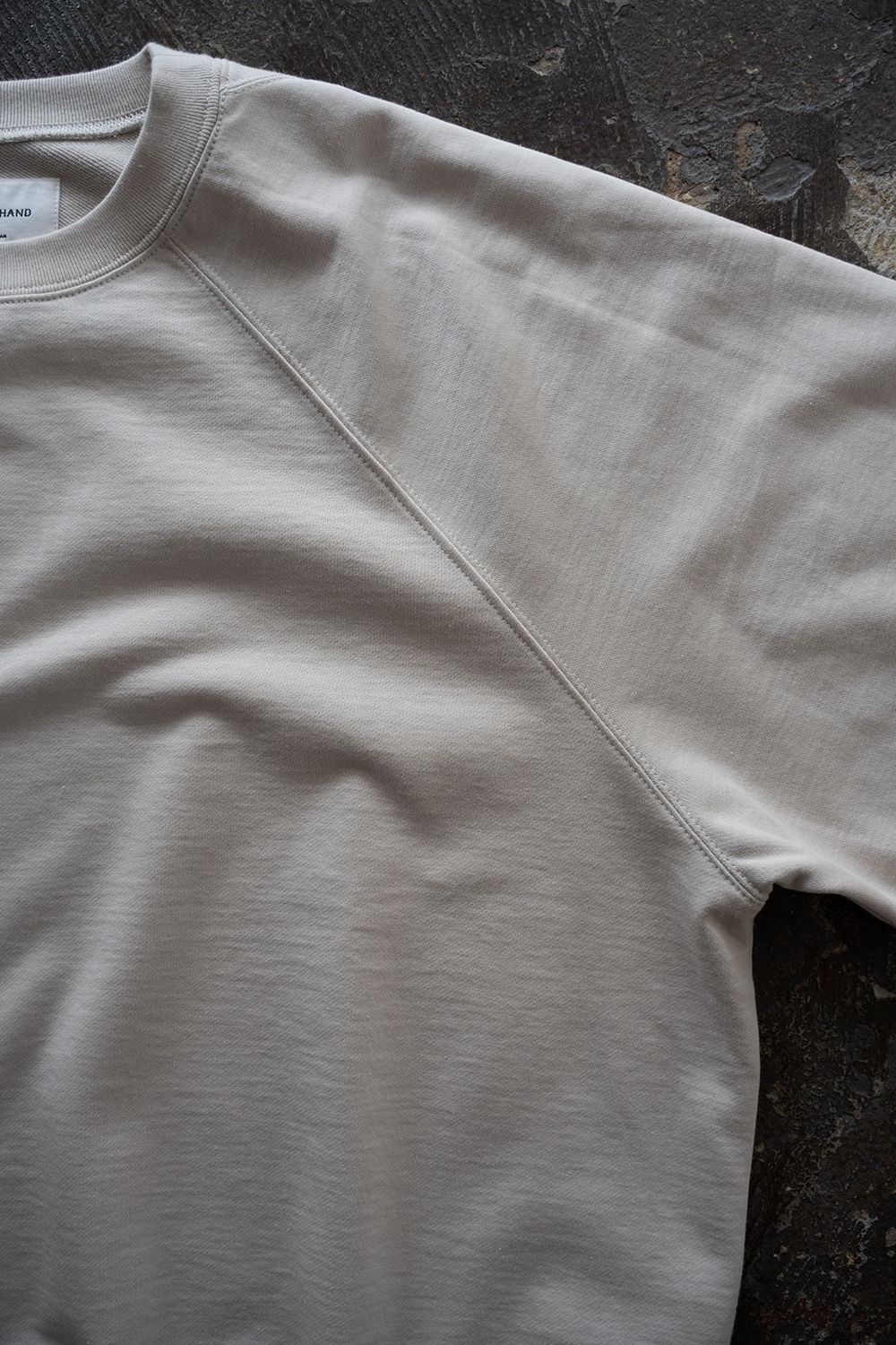 【26AW】ラグランスリーブプルオーバースウェット(ECRU)
