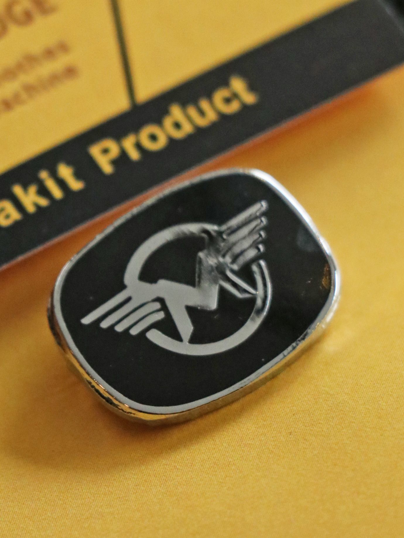 "MATCHLESS M" BADGE