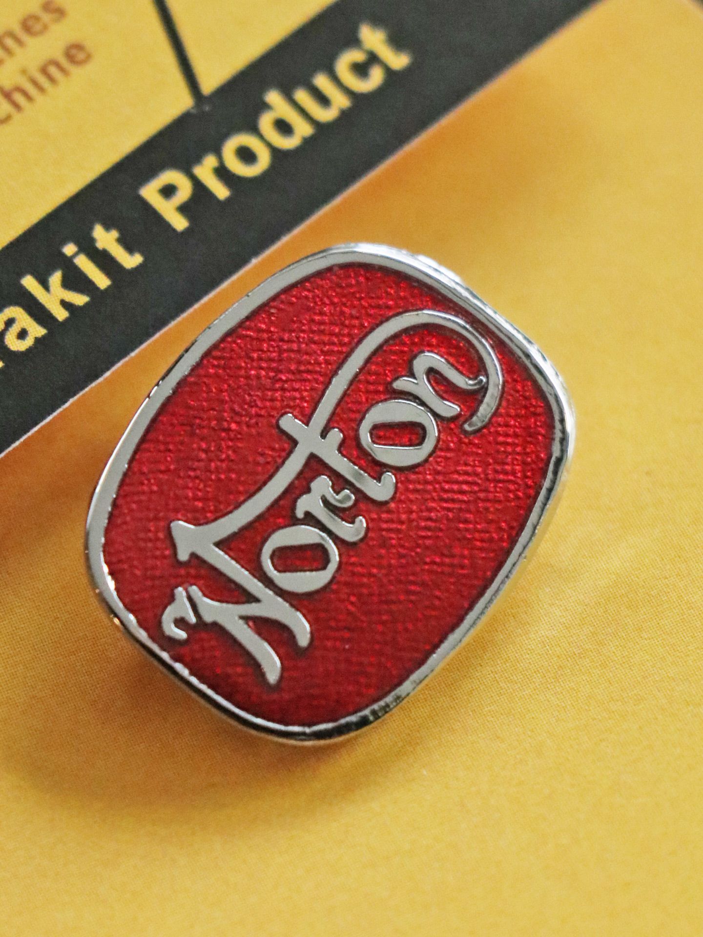 "NORTON CUSHION" BADGE