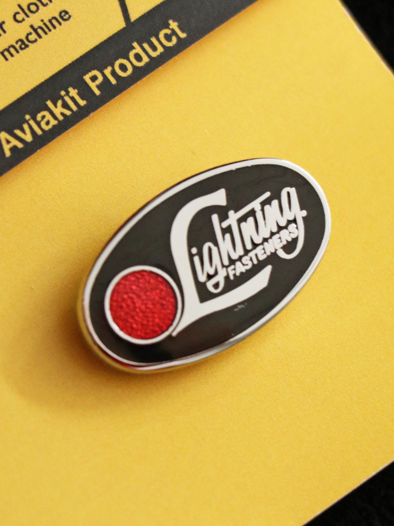 "LIGHTNIG FASTENER" BADGE