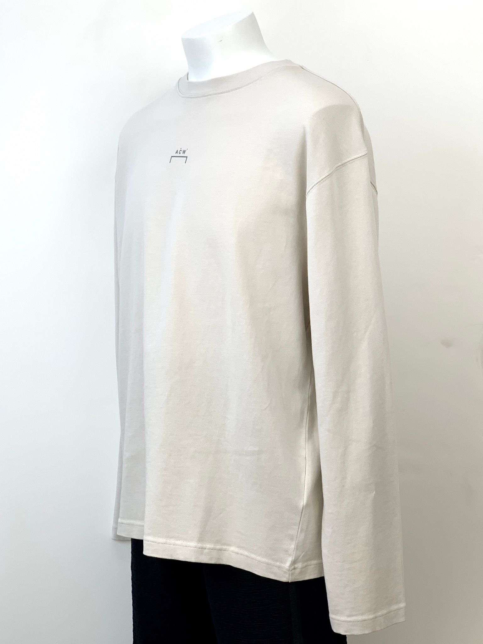 バックペイント ロングスリーブ ジャージTシャツ / COTTON SINGLE JERSEY STONE STENCIL LONG SLEEVE T-SHIRT / ベージュ × ブラック