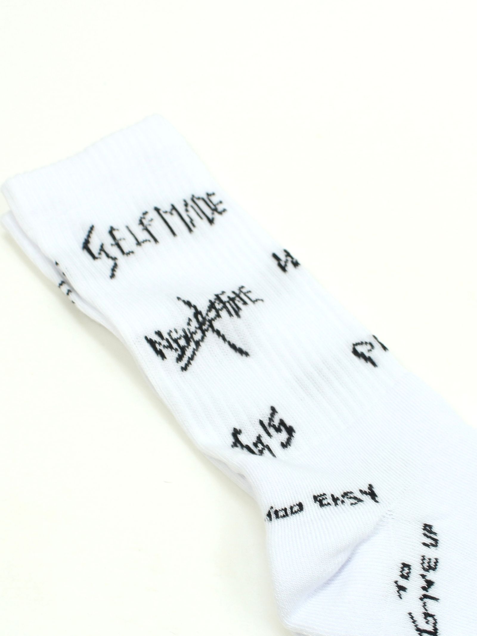 総柄ロゴ ソックス / MANIFESTO ALLOVER SOCKS / ホワイト × ブラック
