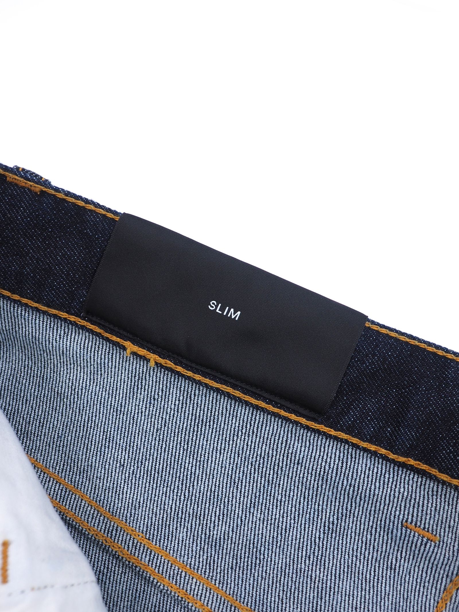 エンボス加工 テーパードデニム PANTS DENIM EMBOSSED MONOGRAM / インディゴ