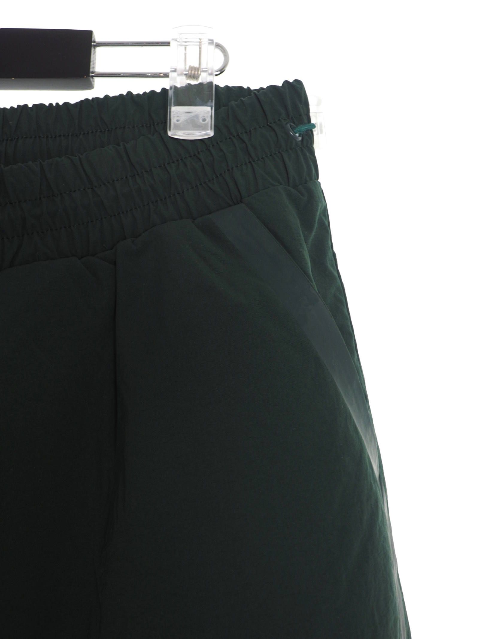 テーププリント トラックパンツ / BRACKET TAPED TRACK PANTS DEEP TEAL / グリーン × ホワイト