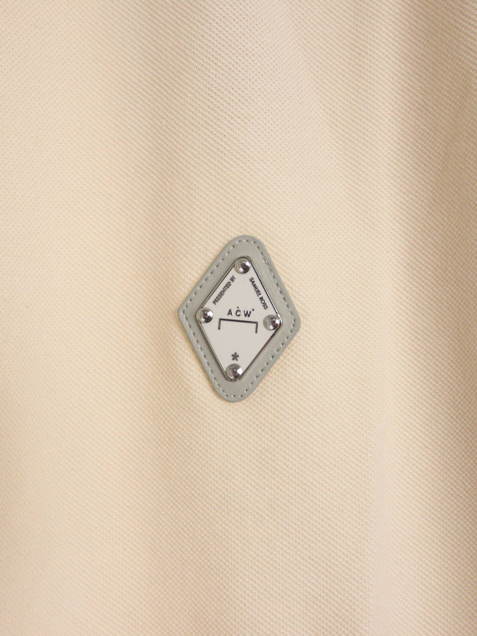 パネルロゴ ポロシャツ / RHOMBUS BADGE POLO MOONBEAM / ベージュ × シルバー