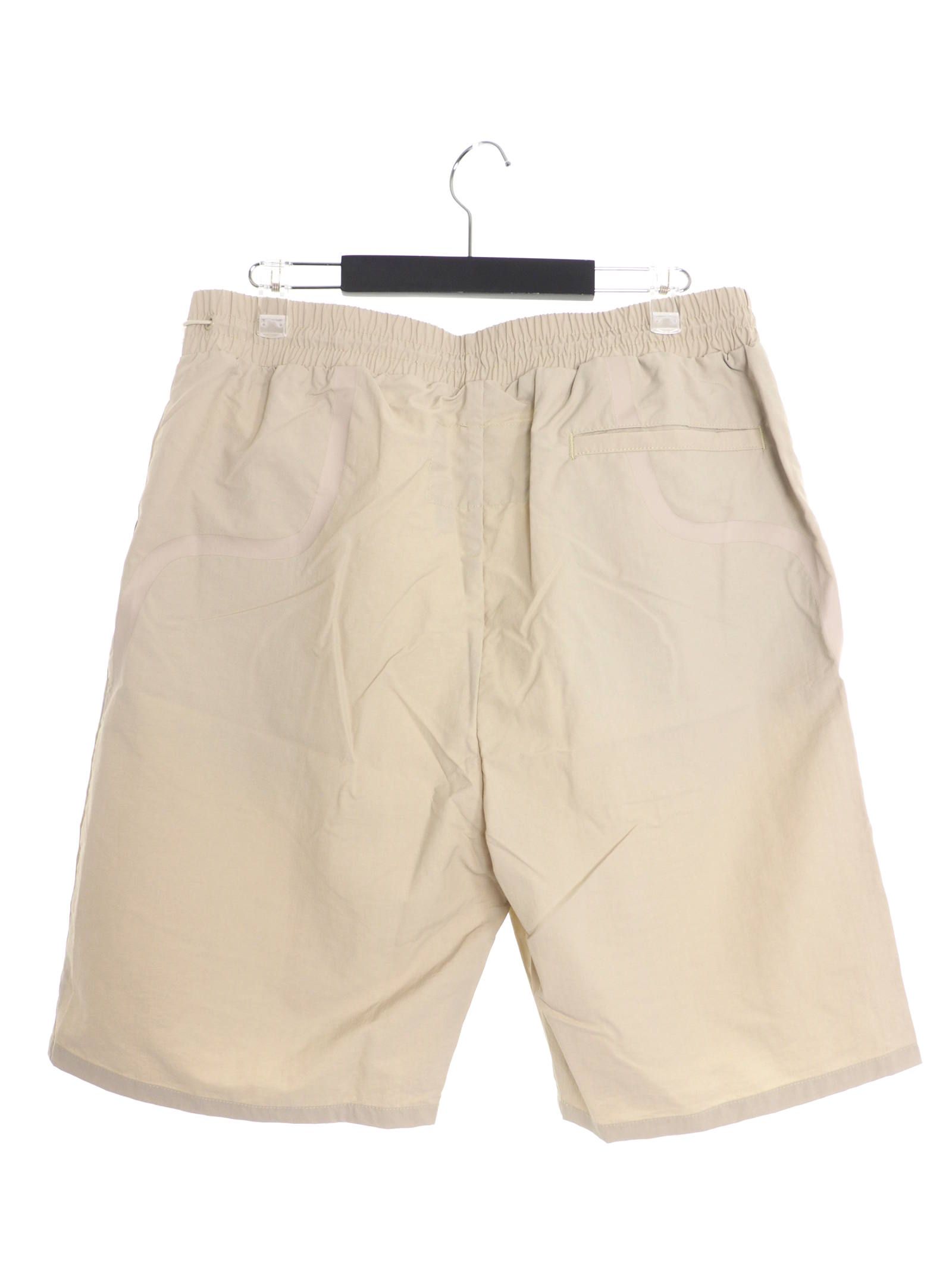 テーププリント トラックショーツ BRACKET TAPED TRACK SHORTS MOONBEAM