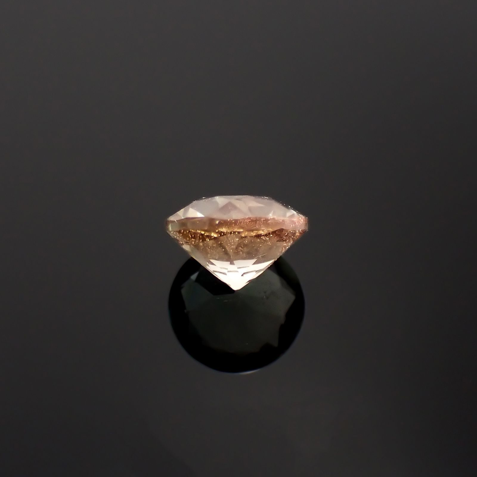 バイカラーオレゴンサンストーン アメリカ・オレゴン州産 0.78ct / 6.1x6mm前後 [230220680]
