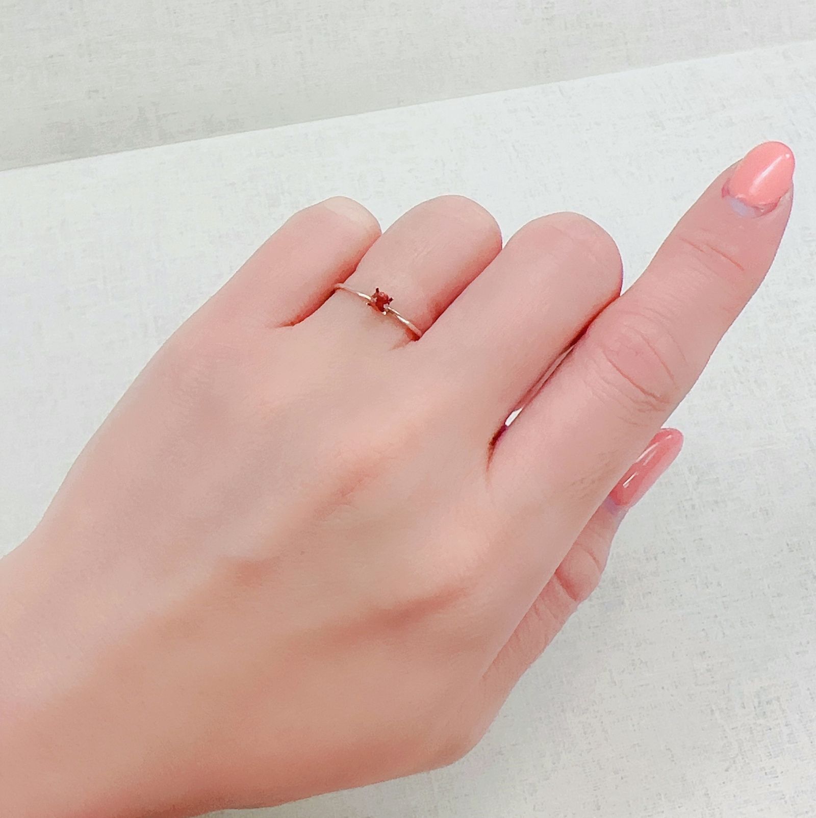 オレンジロードクロサイト 南アフリカ産 0.14ct[230321025]3x2.9mm前後