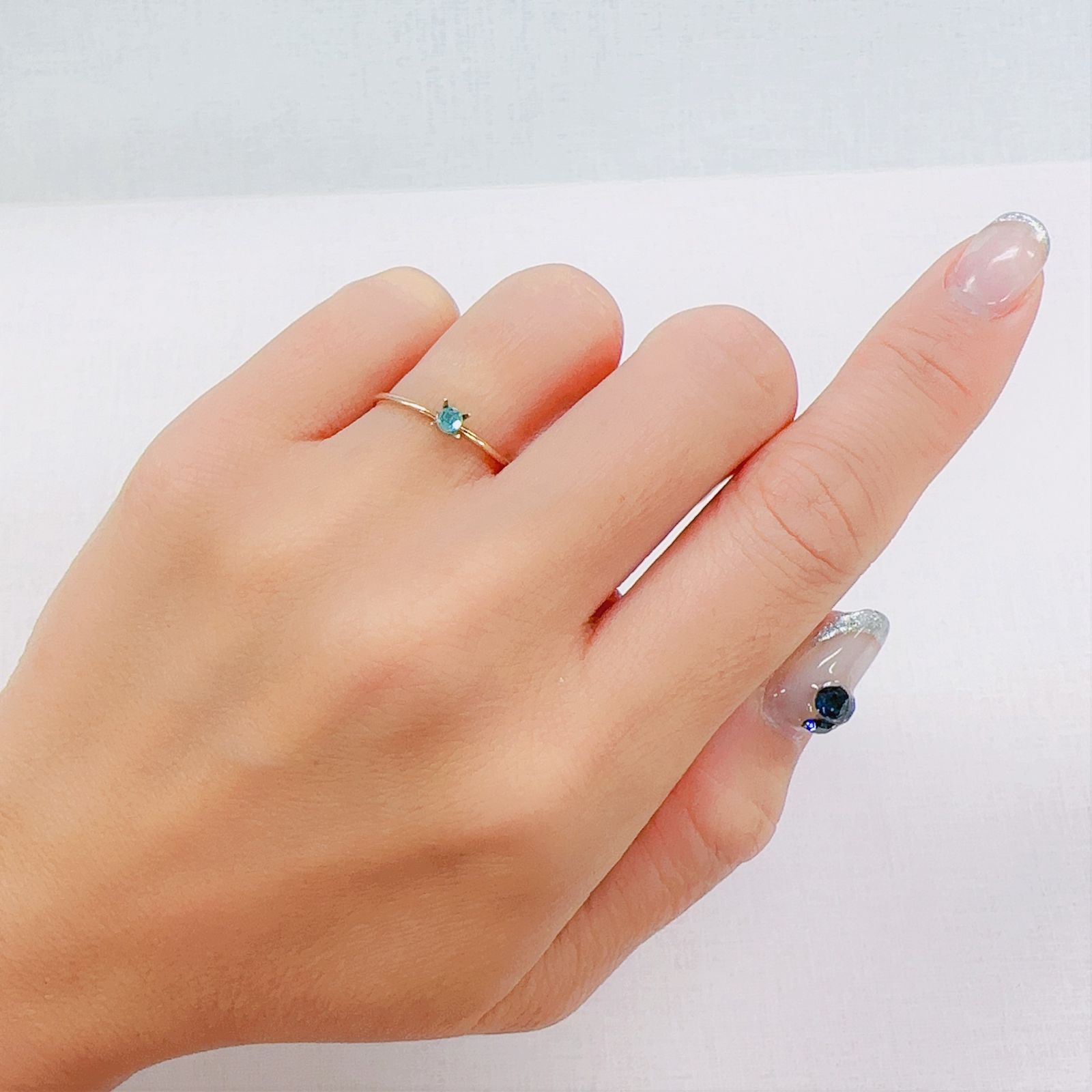 パライバトルマリン(宝石名トルマリン/別名パライバ・トルマリン)ブラジル・パライバ州バターリャ鉱山産 0.049ct 識別済[230622336]2.5x2.5mm前後