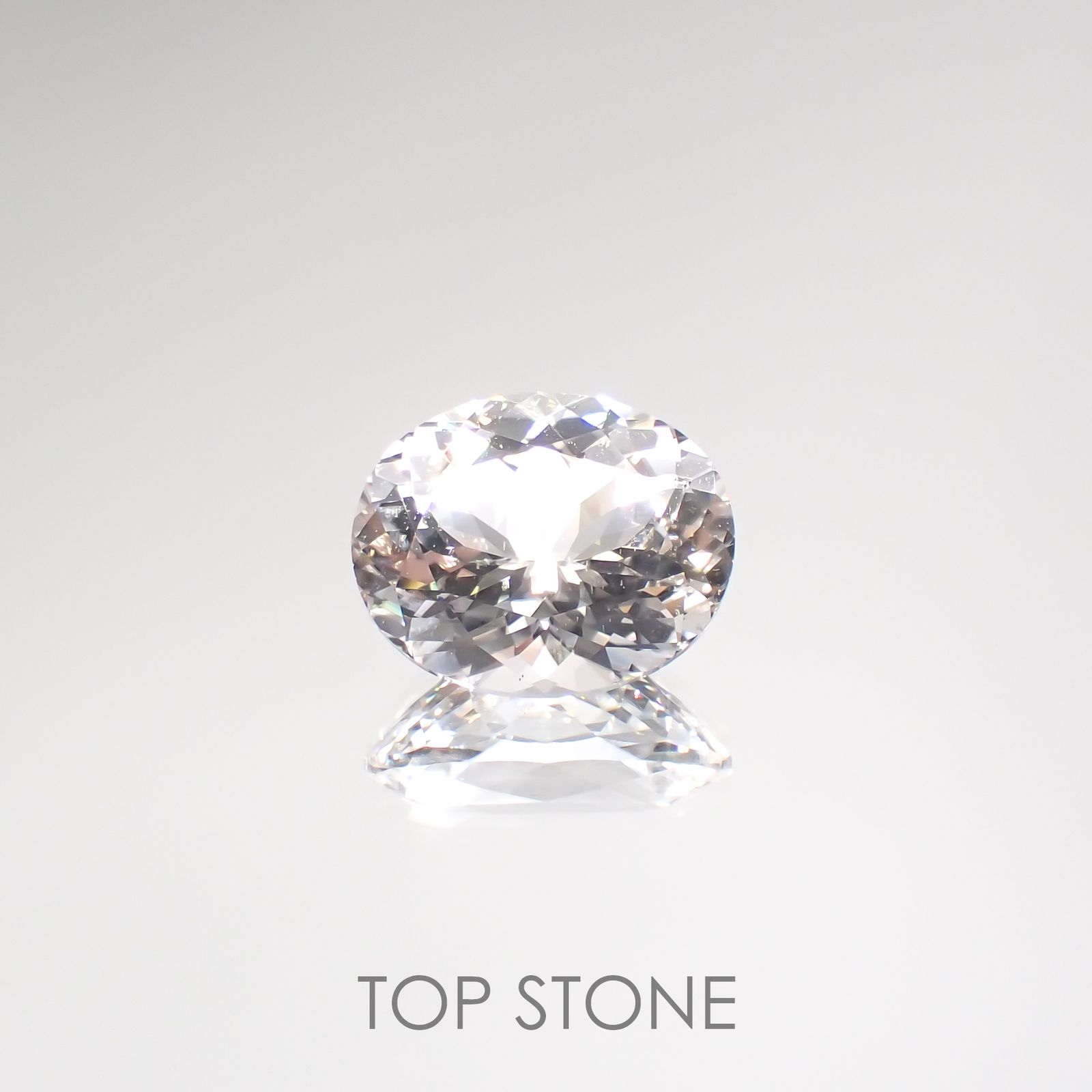 フェナカイト(宝石名ホワイト・フェナカイト) ブラジル産 23.035ct ソ付(彩珠)[210812709]20.6×16.8mm前後