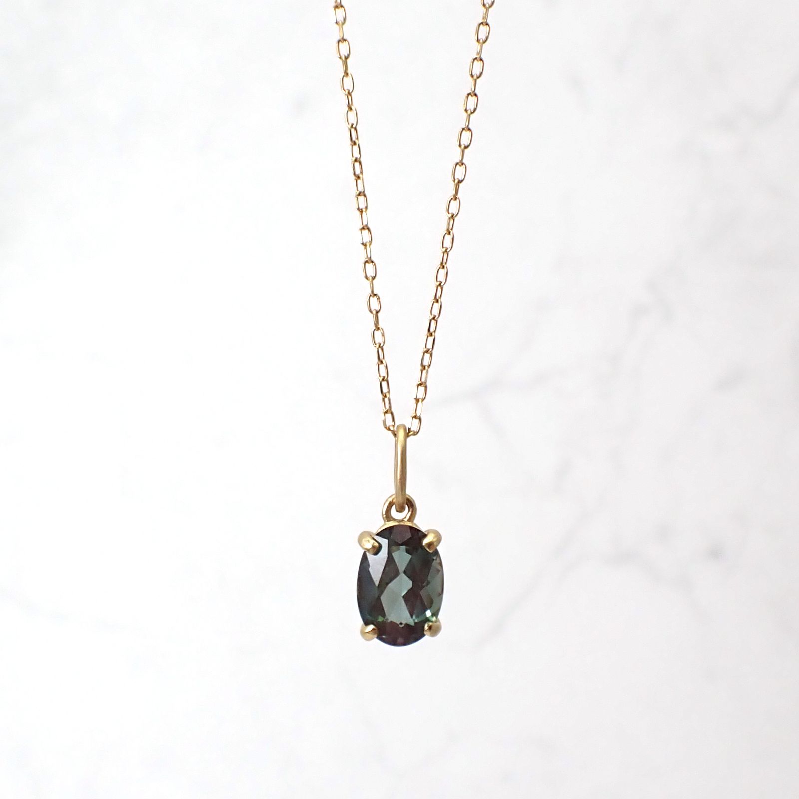 ペンダント空枠：石留め▶カラーチェンジアンデシン（お客様製作例）