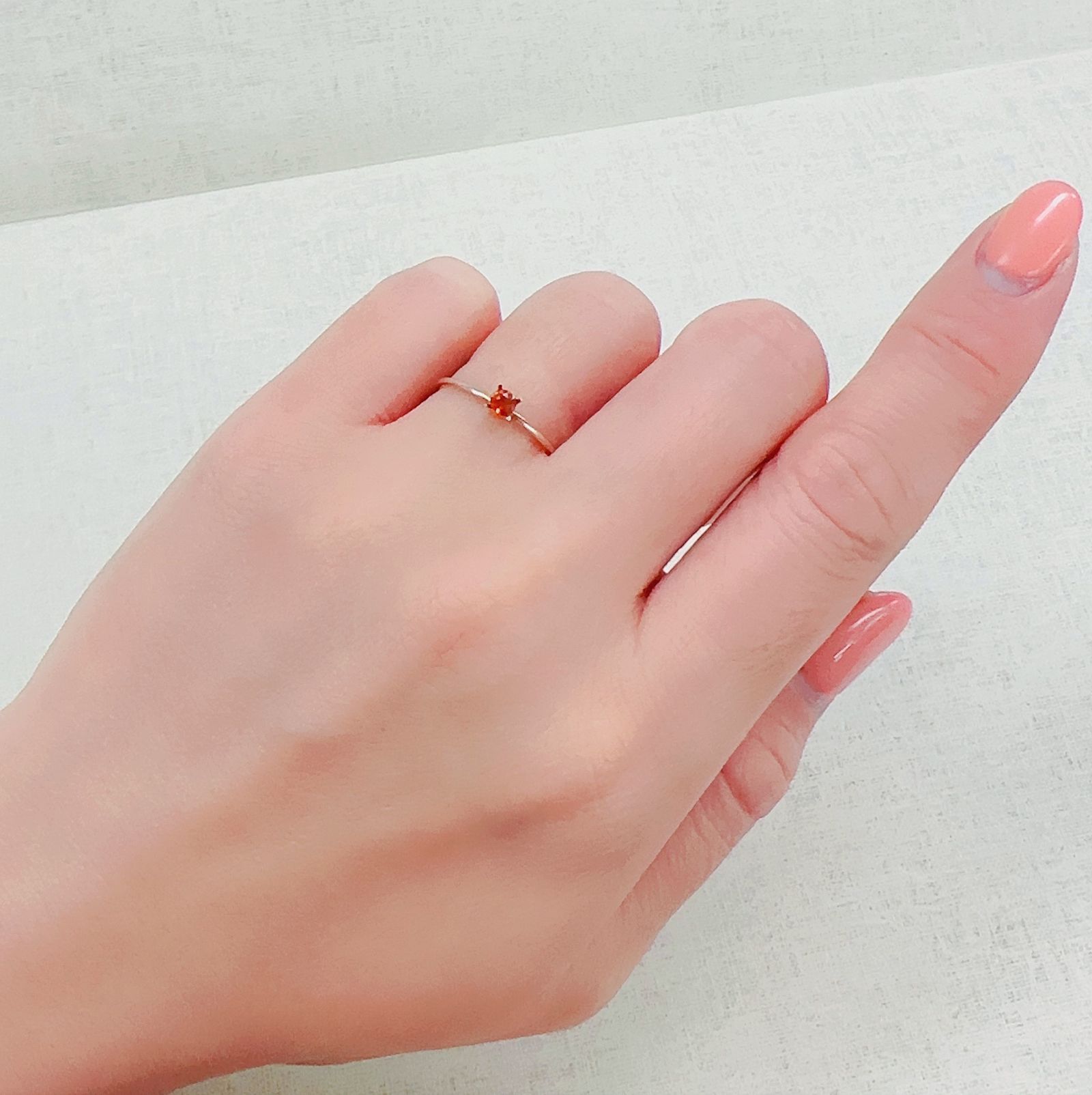 オレンジロードクロサイト 南アフリカ産 0.14ct[230321026]3x2.9mm前後