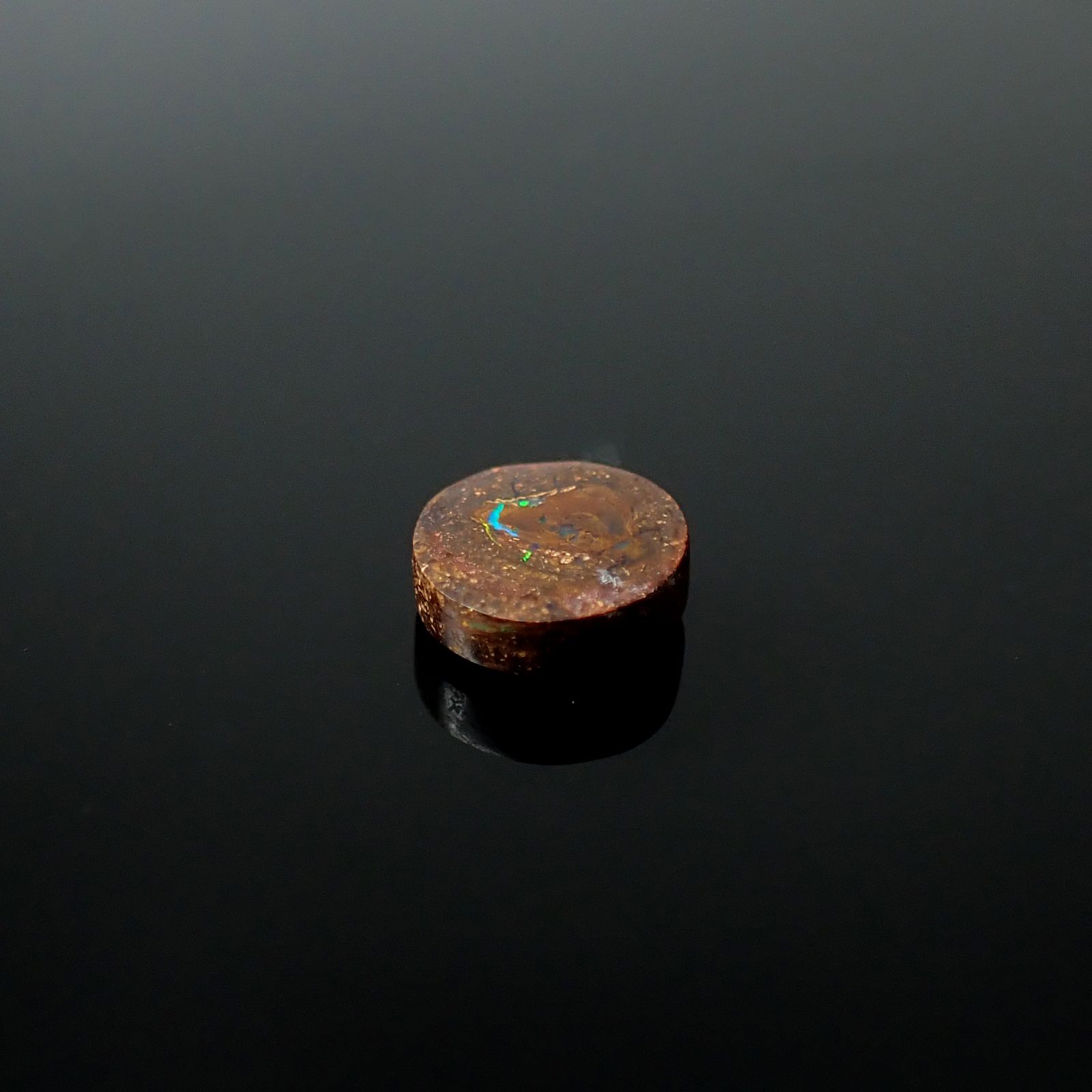 ウッドオパール オーストラリア産 0.89ct / 6.6x6.5mm前後 [251131294]