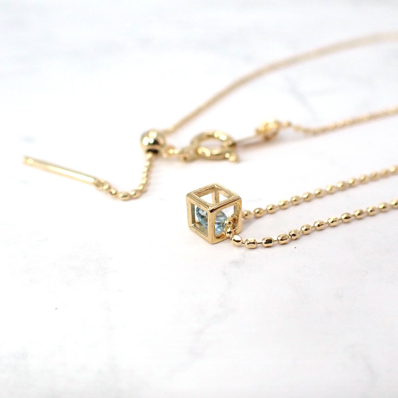 ◇K18 Reinette（レネット）◇ブルートパーズ | キューブボックスデザイン [チャーム/ペンダントトップ※チェーン別売り]