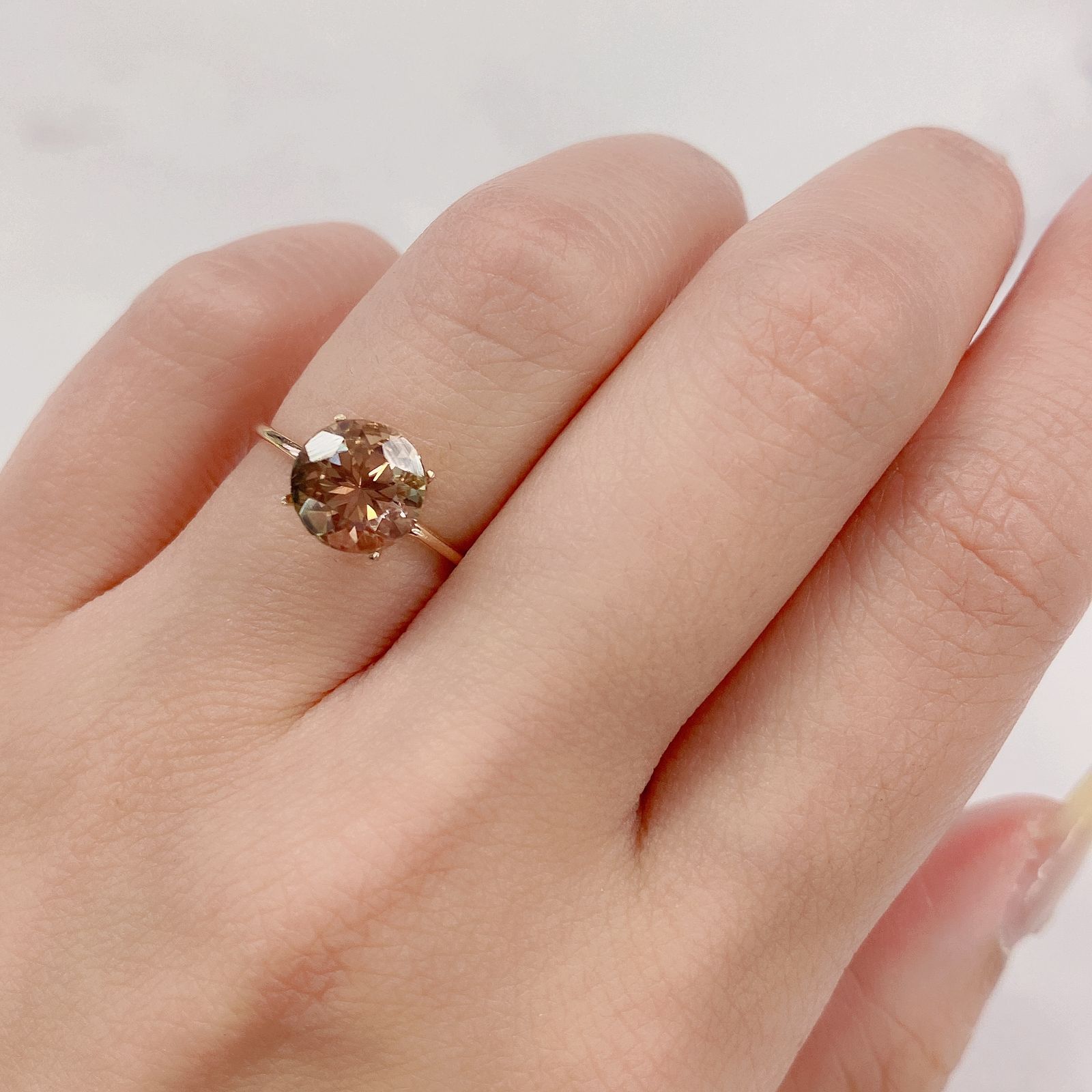 バイカラーオレゴンサンストーン(宝石名バイカラー・ラブラドライト) アメリカ・オレゴン州産ス 1.700ct ソ付(彩珠)[210410538]8×7.9mm前後