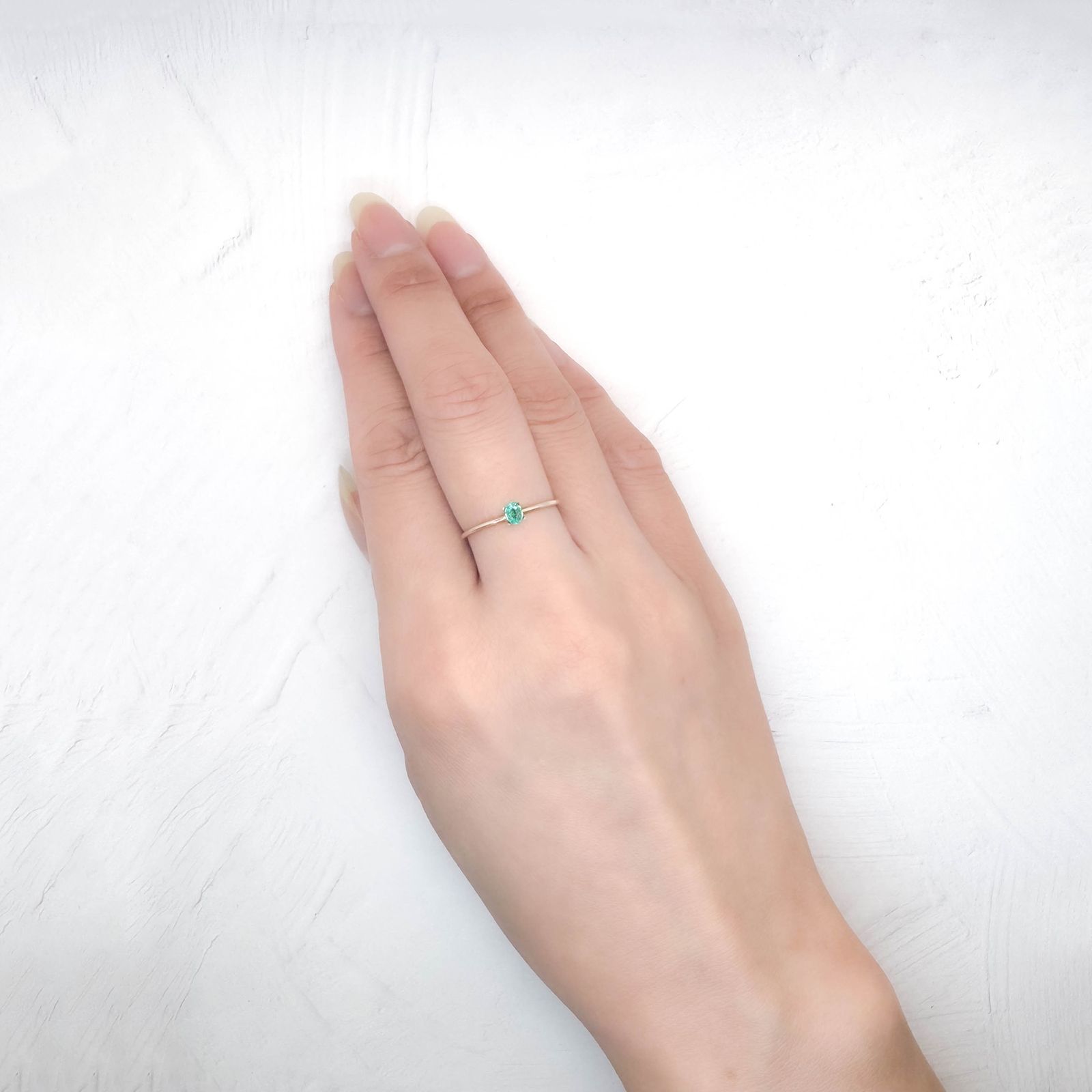 パライバトルマリン(宝石名トルマリン/別名パライバ・トルマリン)ブラジル・パライバ州バターリャ鉱山産 ソ付(GGS) 0.085ct / 3.7x2.7mm前後 [250931077]