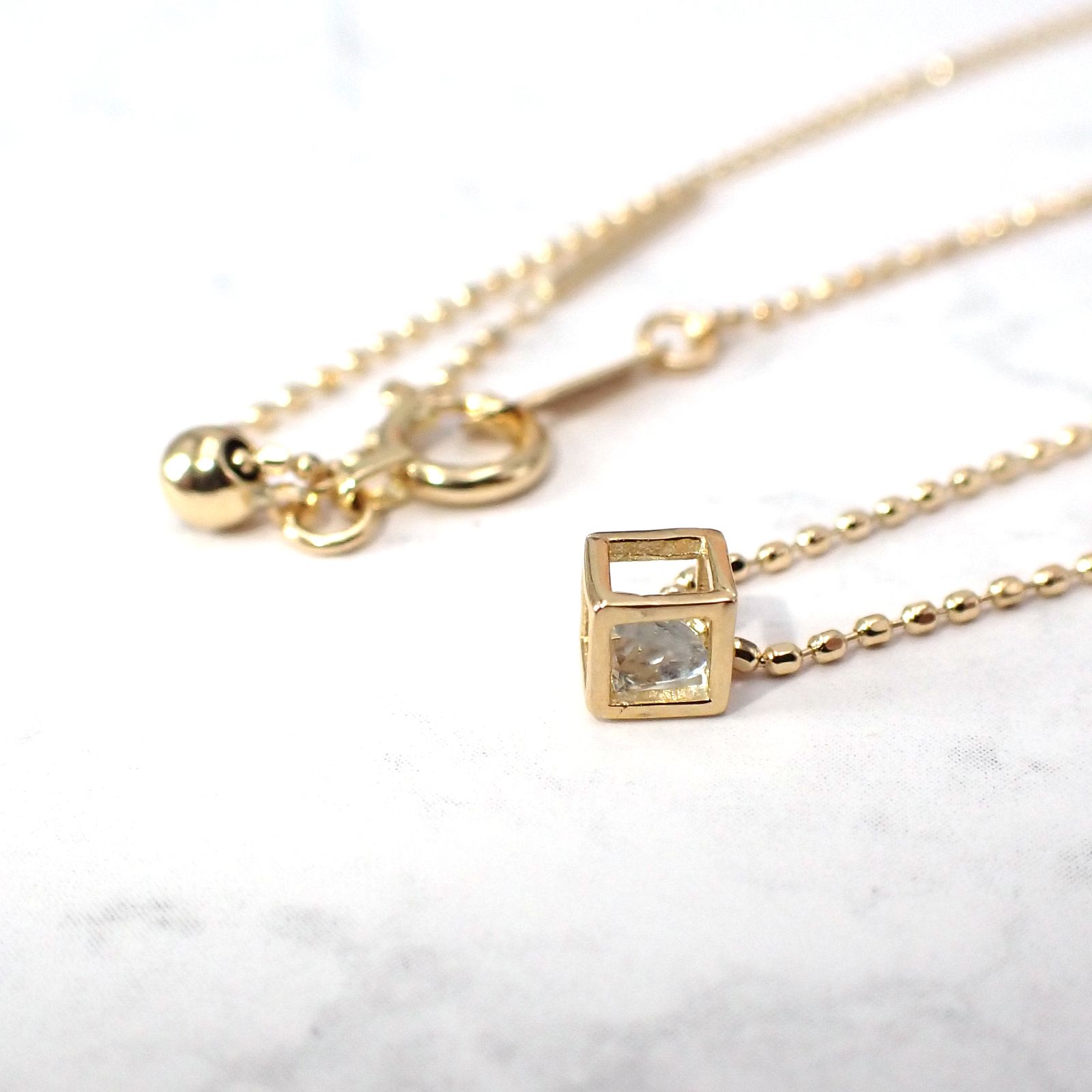◇K18 Reinette（レネット）◇アクアマリン | キューブボックスデザイン [チャーム/ペンダントトップ※チェーン別売り]