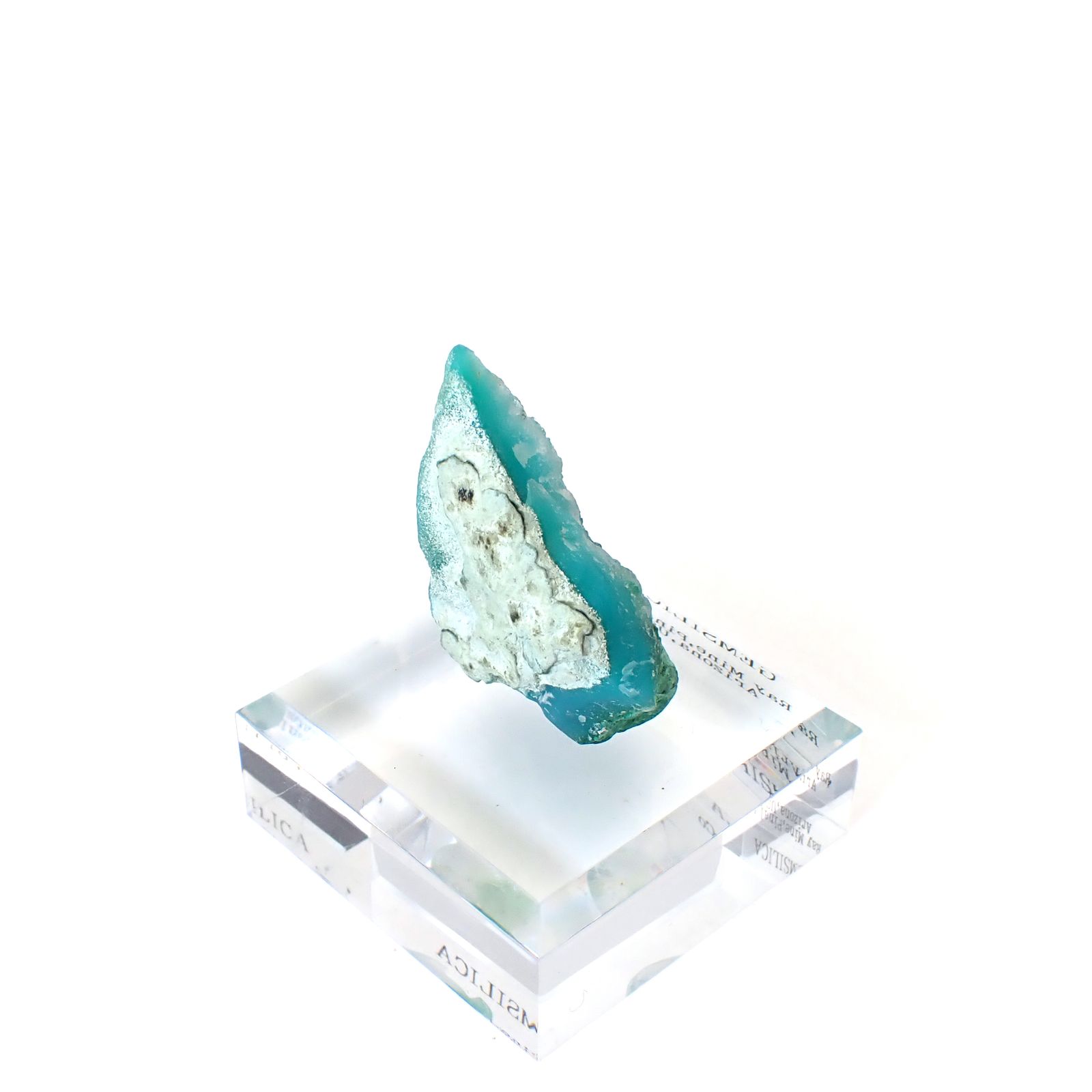 ジェムシリカ原石 アメリカ・アリゾナ州レイマイン産 アクリル台座付き 108.56ct(21.71g) / 20.7x31.4x39.5mm前後 [260632496]