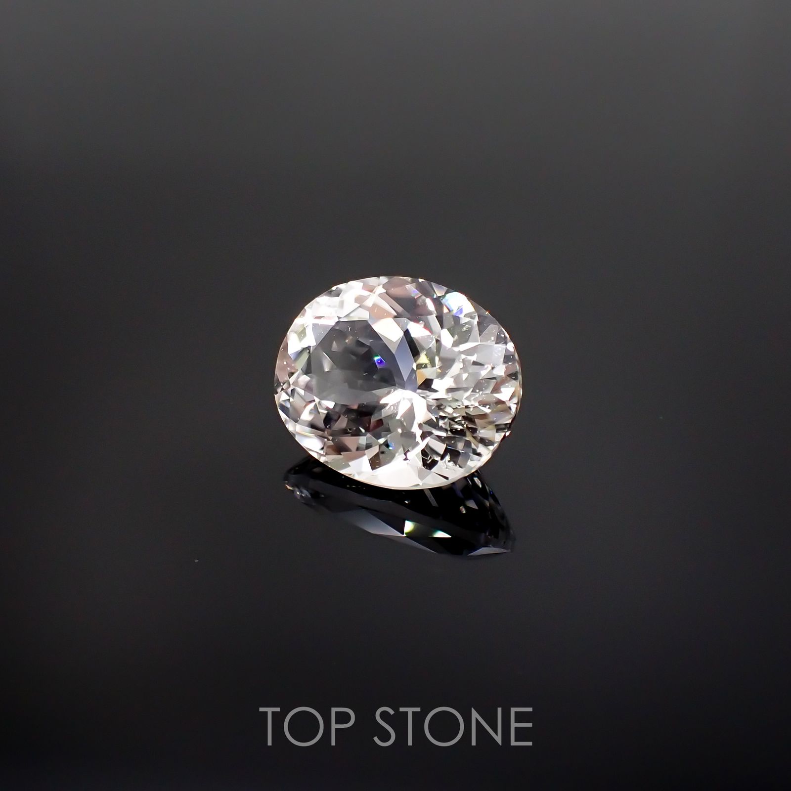 フェナカイト(宝石名ホワイト・フェナカイト) ブラジル産 23.035ct ソ付(彩珠)[210812709]20.6×16.8mm前後