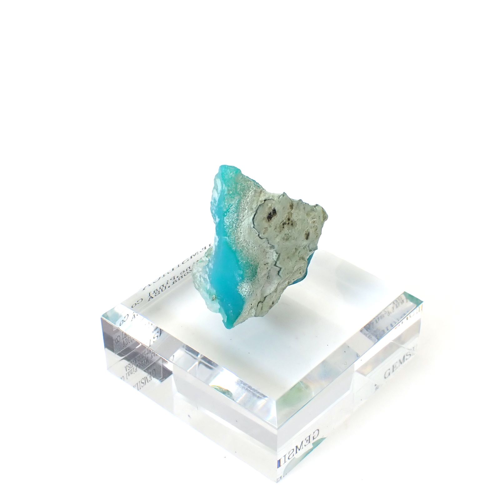 ジェムシリカ原石 アメリカ・アリゾナ州レイマイン産 アクリル台座付き 108.56ct(21.71g) / 20.7x31.4x39.5mm前後 [260632496]