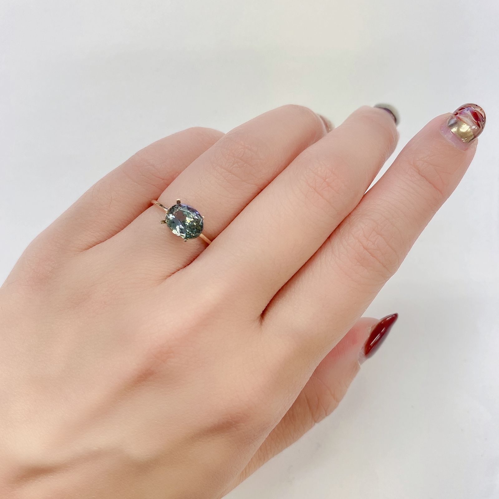 パーティカラータンザナイト(宝石名パーティカラード・ゾイサイト) タンザニア産 1.845ct ソ付(彩珠)[20021990]8.5×6.5mm前後