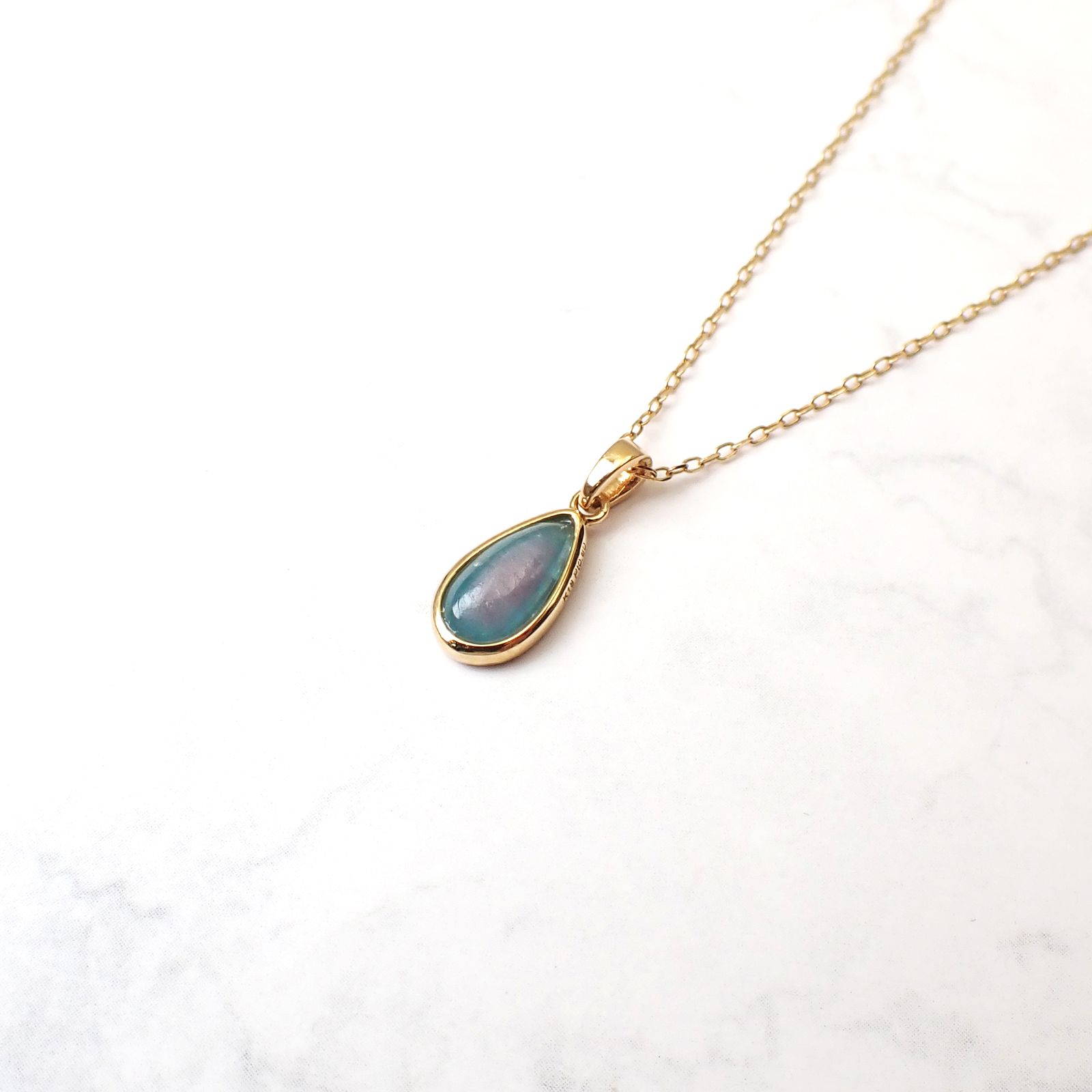 ◇K18ペンダント◇ バイカラーパライバトルマリン ブラジル・バターリャ鉱山産 0.60ct | 手巻き枠 つやあり 5.4x9mm(※チェーン別売り) [241229431]