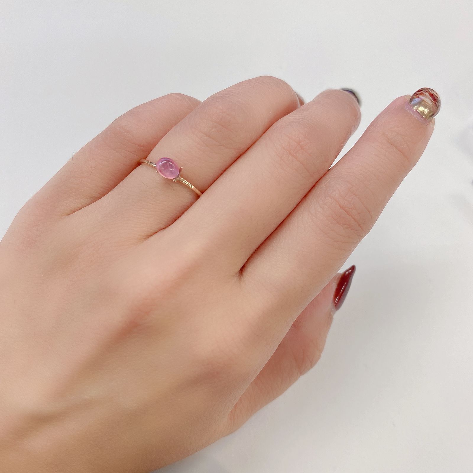ペツォッタイトキャッツアイ(ラズベリル)(宝石名ペツォッタイト・キャッツアイ) マダガスカル産 0.497ct ソ付(彩珠)[210811974]5.1×4.3mm前後