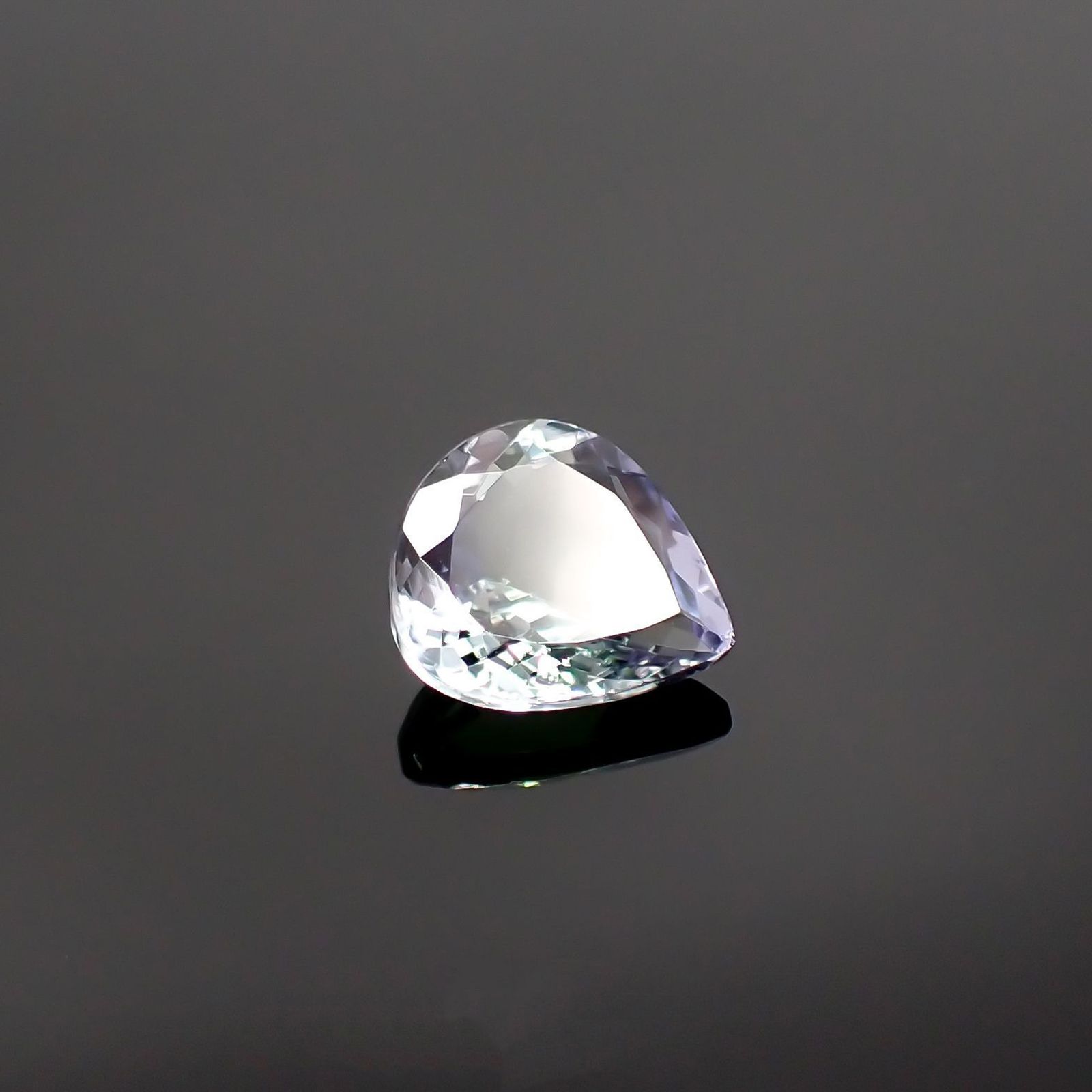 パーティカラータンザナイト(宝石名パーティカラード・ゾイサイト) タンザニア産 ソ付(彩珠) 1.342ct / 7.8x7.1mm前後 [210711816]