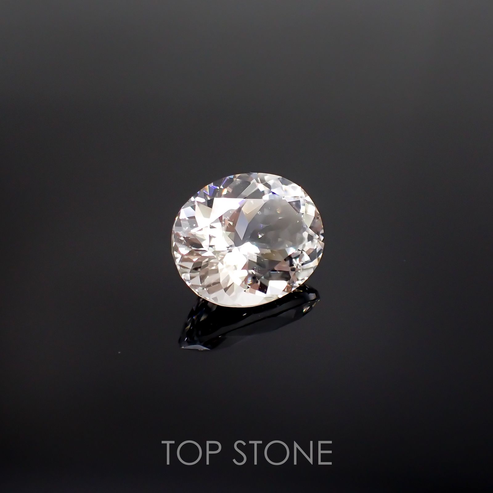フェナカイト(宝石名ホワイト・フェナカイト) ブラジル産 23.035ct ソ付(彩珠)[210812709]20.6×16.8mm前後
